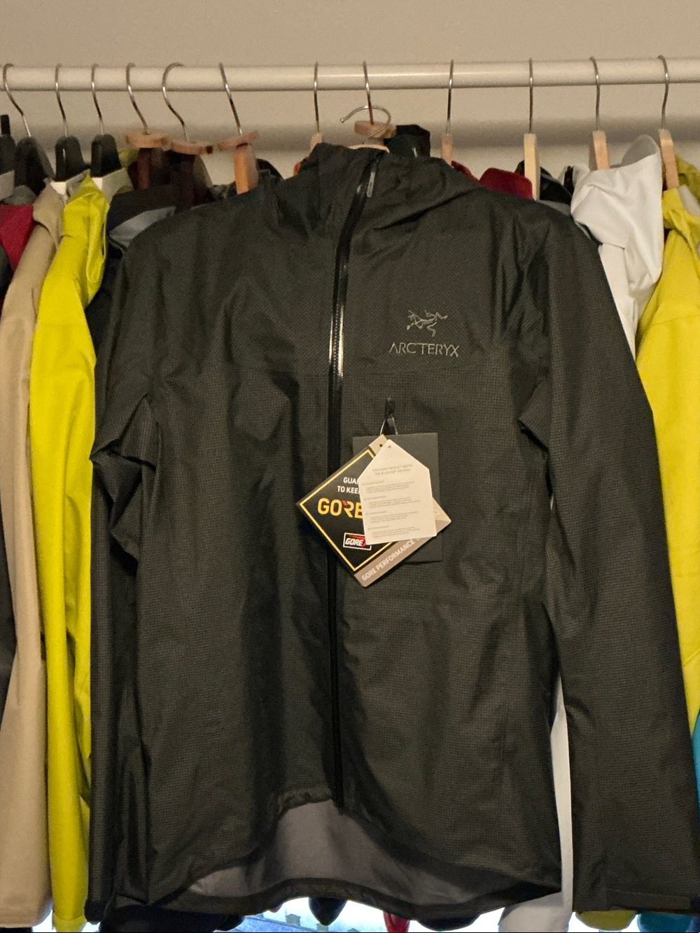 Arc'teryx Men's Black Alpha lightweight Gore‑Tex Hooded Rain Jacket. Size small.